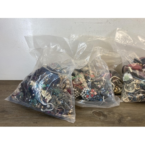 389 - Six bags containing costume jewellery