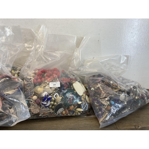 390 - Five bags containing costume jewellery