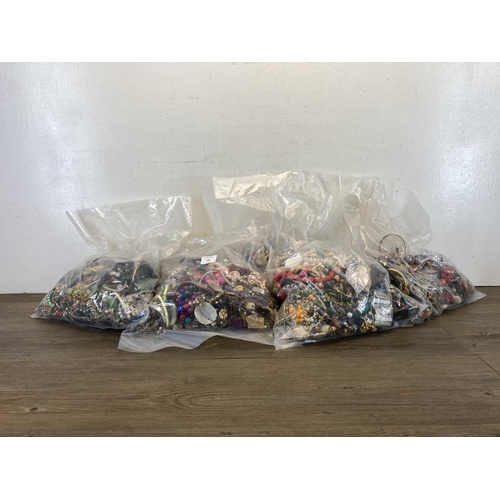 395 - Five bags containing costume jewellery