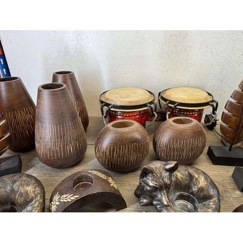 423 - A collection of items to include wooden squirrel bowl, bongos, stoneware lamp etc.