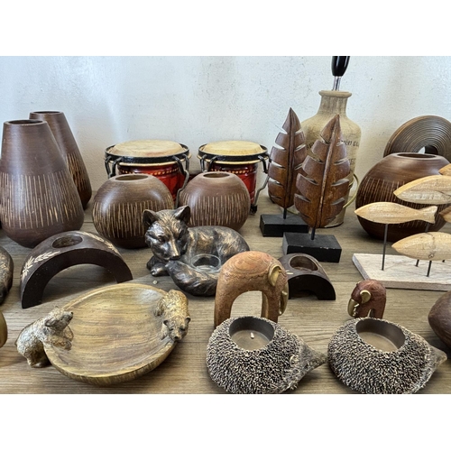 423 - A collection of items to include wooden squirrel bowl, bongos, stoneware lamp etc.