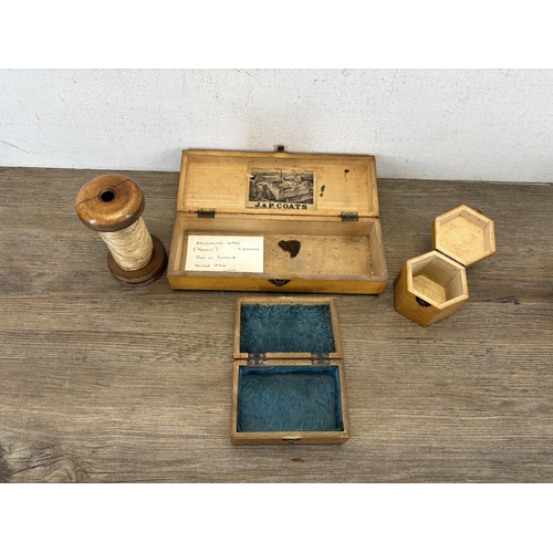 431 - Three Mauchline ware boxes and one wooden cotton reel