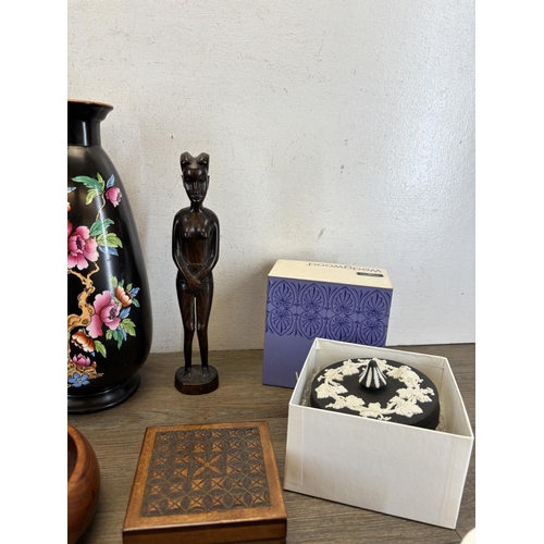 434 - A collection of items to include early 20th century Devon Ware Fielding vase, African carved hardwoo... 