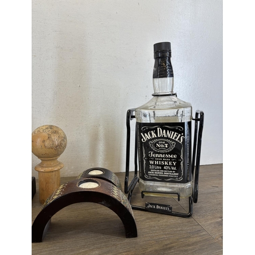 440 - A collection of items to include pair of The Pier handmade resin elephant bookends, Jack Daniels 3L ... 