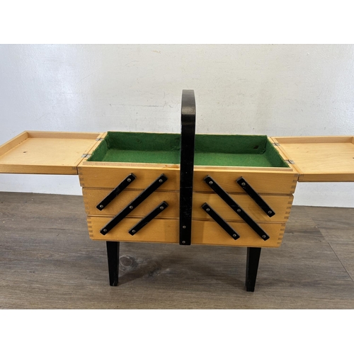 447 - A mid 20th century beech and ebonised concertina sewing box - approx. 46cm high x 42cm wide x 21cm d... 