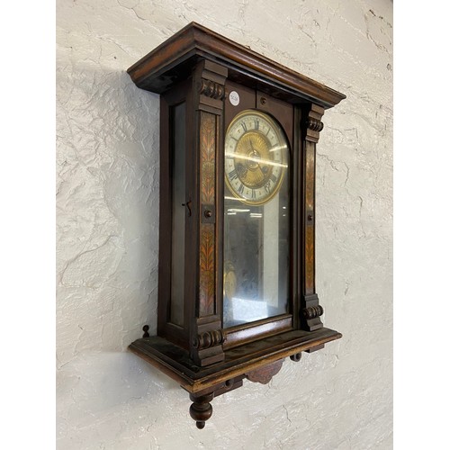 2A - A late 19th century walnut cased chiming wall clock with hand painted floral decoration, enamel face... 