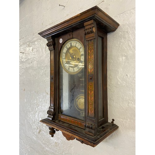 2A - A late 19th century walnut cased chiming wall clock with hand painted floral decoration, enamel face... 