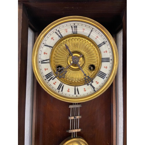 2A - A late 19th century walnut cased chiming wall clock with hand painted floral decoration, enamel face... 