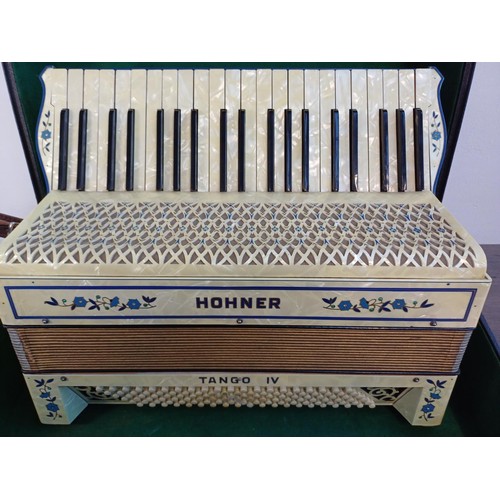 574 - A cased vintage Hohner Tango IV 120 bass piano accordion