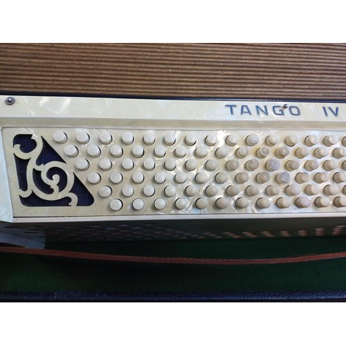 574 - A cased vintage Hohner Tango IV 120 bass piano accordion