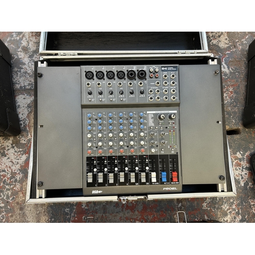 576 - A PA system comprising cased QSC Audio RMX2450 professional power amplifier, Dynamix live mix 8-2 ei... 