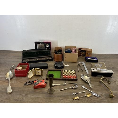 398 - A collection of items to include Recta compass, EPNS spoons, WWII Sunderland ready light, miniature ... 