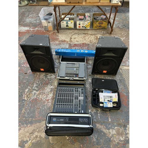 576 - A PA system comprising cased QSC Audio RMX2450 professional power amplifier, Dynamix live mix 8-2 ei... 