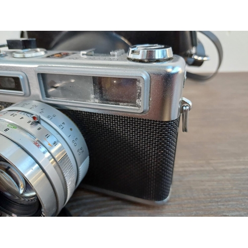 71 - Two Yashica 35mm cameras, one cased late 1960s Electro 35 G rangefinder fitted with Yashinon-DX 1:1.... 