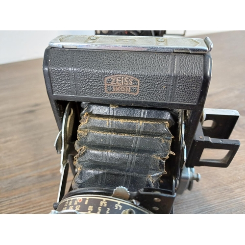 76 - Two Zeiss Ikon Ikonta folding cameras for 120 film, one 1930s 520/2 taking 6x9 images fitted with No... 