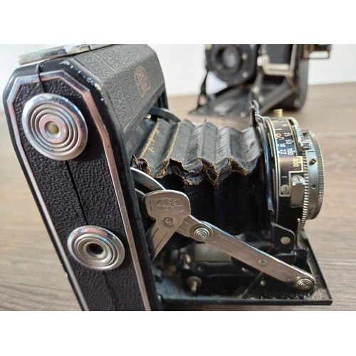 76 - Two Zeiss Ikon Ikonta folding cameras for 120 film, one 1930s 520/2 taking 6x9 images fitted with No... 