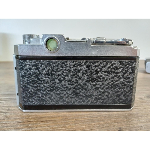 81 - Two cased Japanese 35mm rangefinder cameras, one Walz 35-S (A/F) fitted with Nitto S Kominar 1:3.5 f... 