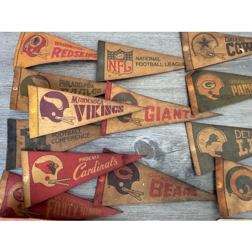 422 - Nineteen NFL pennants and signs to include Dallas Cowboys, Green Bay Packers, Philadelphia Eagles et... 