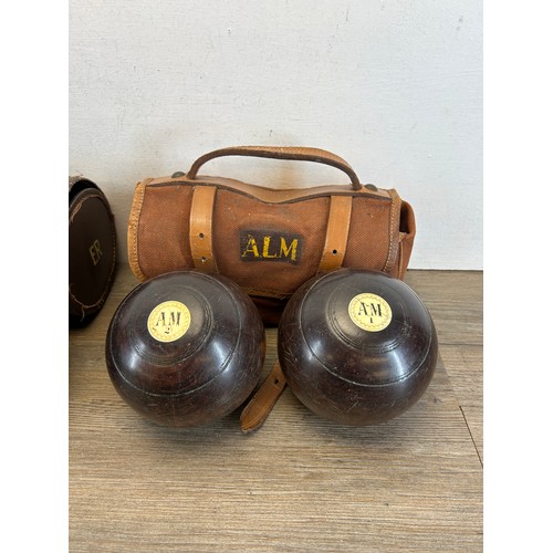 411 - Two pairs of early 20th century cased crown green bowls