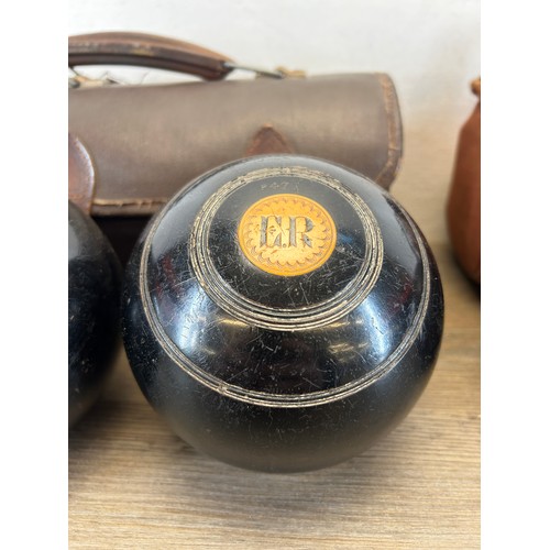 411 - Two pairs of early 20th century cased crown green bowls