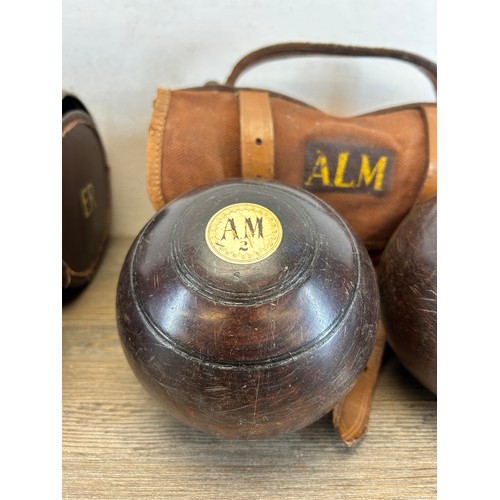 411 - Two pairs of early 20th century cased crown green bowls