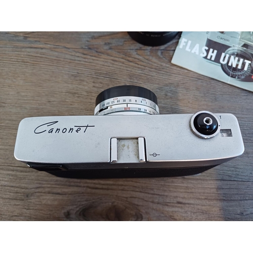 84 - Three Canon items, one cased Canonet automatic-exposure 35mm rangefinder camera fitted with SE 1:1.9... 