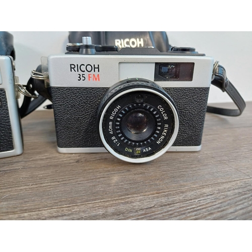 91 - Two cased Ricoh 35mm cameras fitted with Rikenon 1:2.8 f=40mm lenses, one 500 G compact coupled rang... 