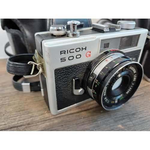 91 - Two cased Ricoh 35mm cameras fitted with Rikenon 1:2.8 f=40mm lenses, one 500 G compact coupled rang... 