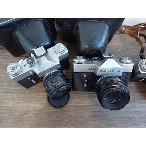 245 - Five KMZ Zenit B 35mm SLR cameras, two cased fitted with Helios-44-2 2.8/58 lenses, one fitted with ... 