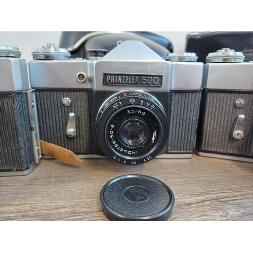 245 - Five KMZ Zenit B 35mm SLR cameras, two cased fitted with Helios-44-2 2.8/58 lenses, one fitted with ... 