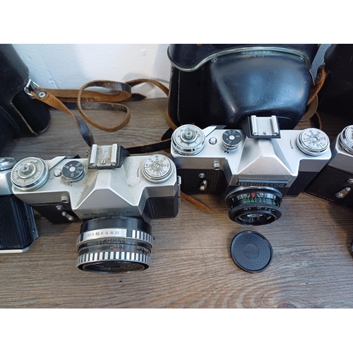 245 - Five KMZ Zenit B 35mm SLR cameras, two cased fitted with Helios-44-2 2.8/58 lenses, one fitted with ... 