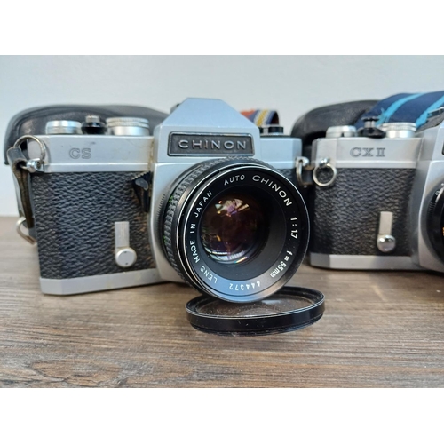 247 - Four Chinon 35mm SLR cameras fitted with 1:1.7 55mm lenses, two cased CS, one cased CX II and one pa... 