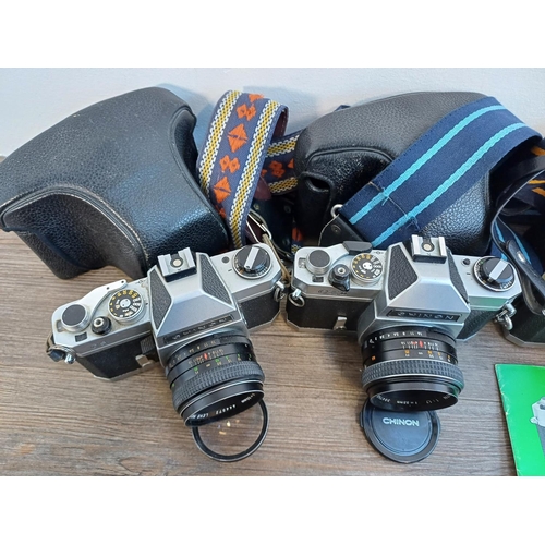 247 - Four Chinon 35mm SLR cameras fitted with 1:1.7 55mm lenses, two cased CS, one cased CX II and one pa... 