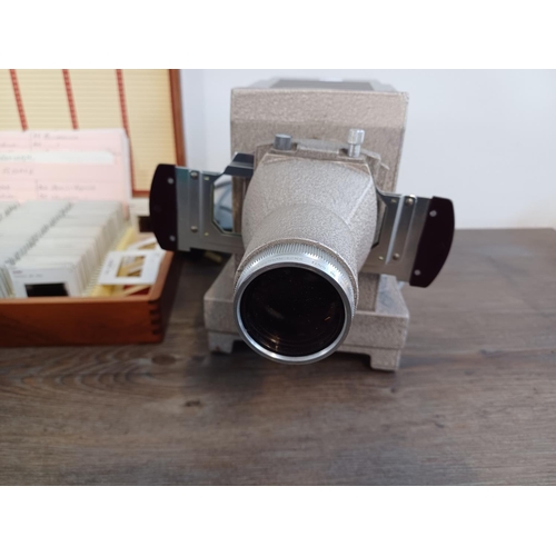 250 - Three slide items, one Zeiss Ikon Perkeo Compact projector fitted with Talon 1:2.8/85 lens, one Rank... 