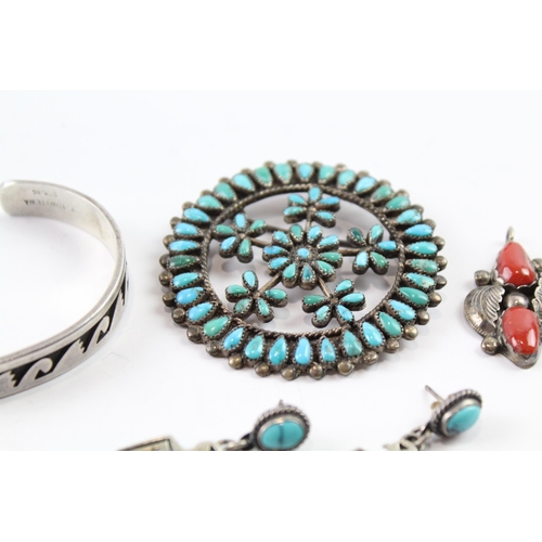 2074 - Four pieces of Native American sterling silver jewellery to include turquoise brooch etc. - approx. ... 