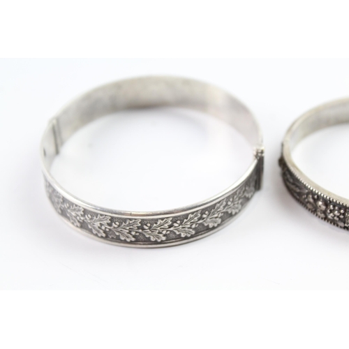 2076 - Two sterling silver floral bangles to include oak leaf design etc. - approx. gross weight 53g