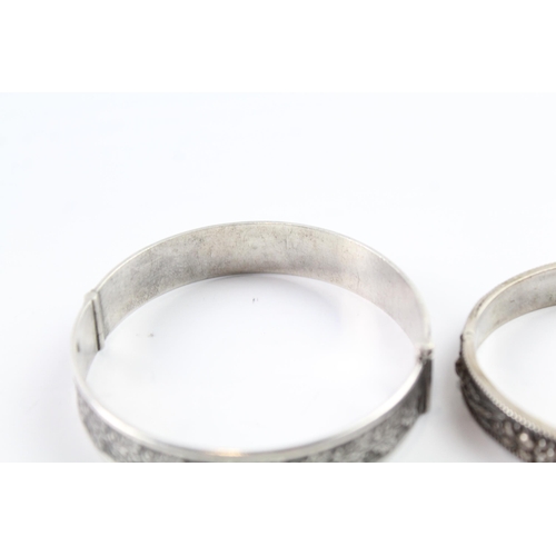 2076 - Two sterling silver floral bangles to include oak leaf design etc. - approx. gross weight 53g