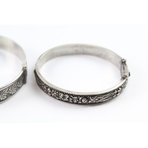 2076 - Two sterling silver floral bangles to include oak leaf design etc. - approx. gross weight 53g