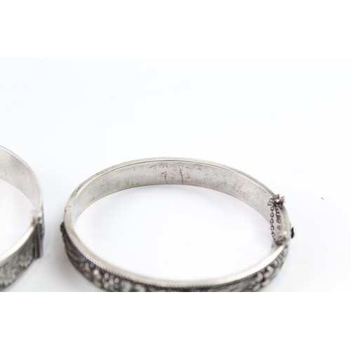 2076 - Two sterling silver floral bangles to include oak leaf design etc. - approx. gross weight 53g