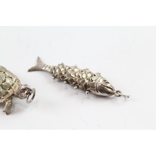 2081 - Two sterling silver animal pendants to include articulated fish - approx. gross weight 22g