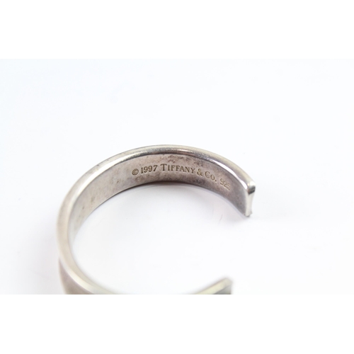 2101 - A Tiffany & Co sterling silver concave cuff bangle - approx. gross weight 42g