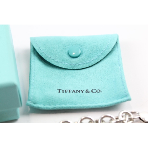 2117 - A boxed Tiffany & Co sterling silver charm bracelet with replacement clasp - approx. gross weight 45... 