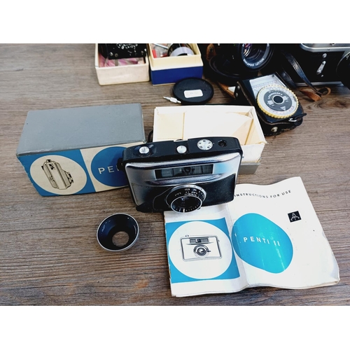 252 - A collection of vintage items to include boxed Pentacon Penti SL-System compact camera with instruct... 