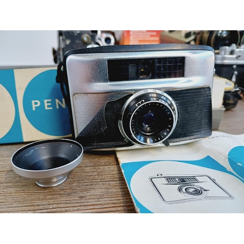 252 - A collection of vintage items to include boxed Pentacon Penti SL-System compact camera with instruct... 