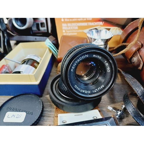 252 - A collection of vintage items to include boxed Pentacon Penti SL-System compact camera with instruct... 