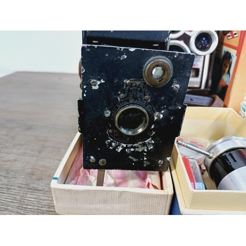 252 - A collection of vintage items to include boxed Pentacon Penti SL-System compact camera with instruct... 