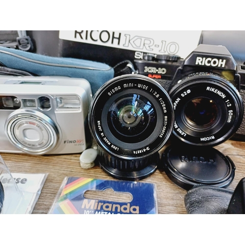 253 - A collection of cameras and photography accessories to include cased Ricoh KR-10 Super 35mm SLR came... 