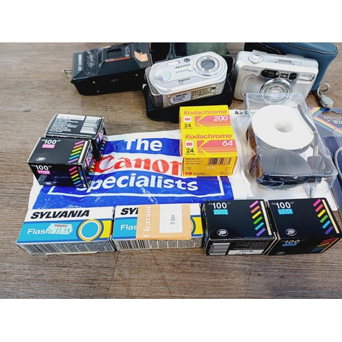 253 - A collection of cameras and photography accessories to include cased Ricoh KR-10 Super 35mm SLR came... 