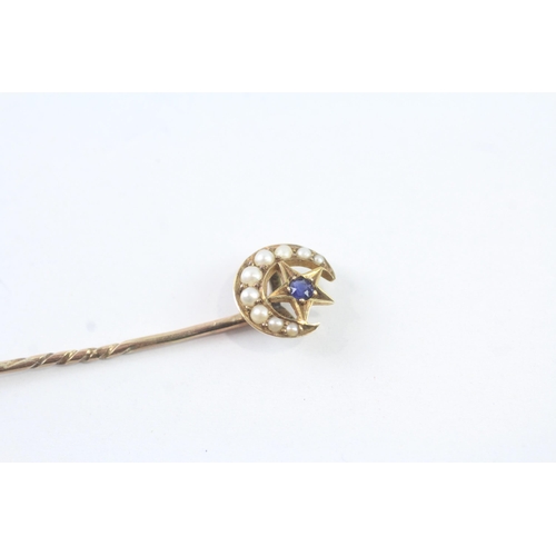 2002 - A pearl and sapphire stick pin with 15ct gold head and 9ct gold body - approx. gross weight 1.2g