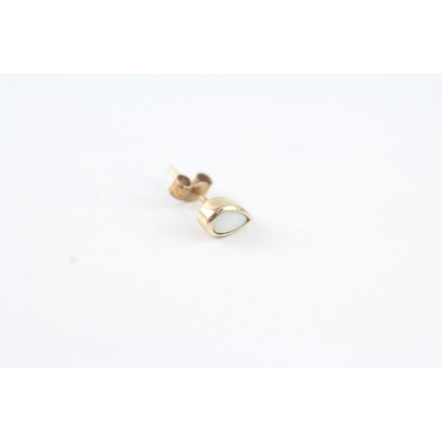 2008 - A pair of 9ct gold pearshape opal stud earrings - approx. gross weight 0.6g